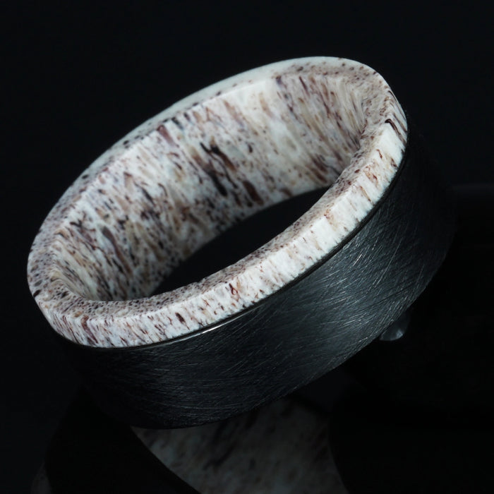 Crest deer antler ring edged in brushed black titanium